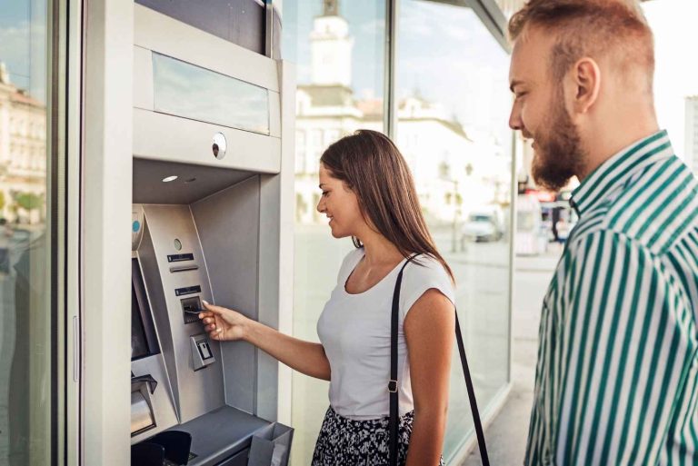 couple using an ATM