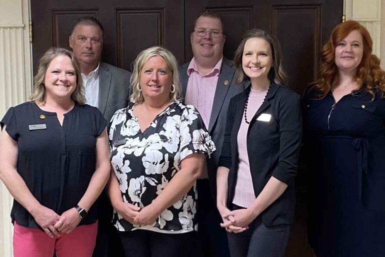 group of six City employees posing for a photo